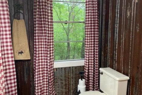 a shower that has a sink and a window