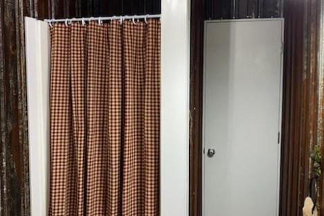 a shower curtain next to a sink