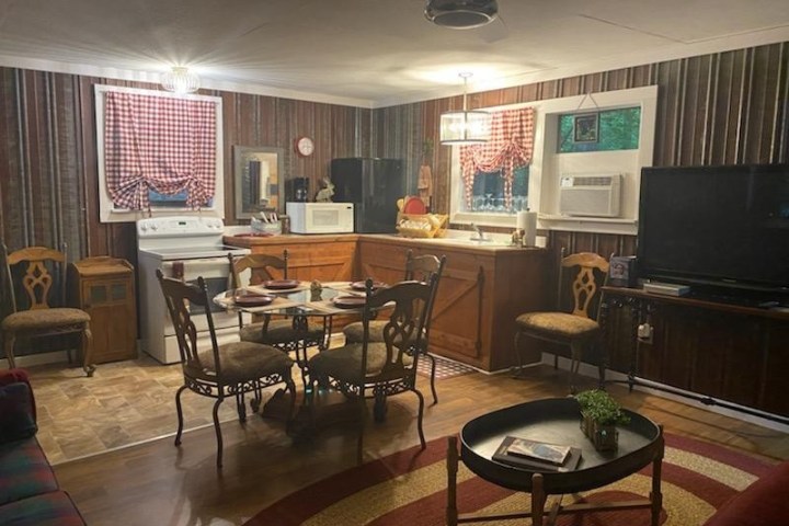 a living room filled with furniture and a large window