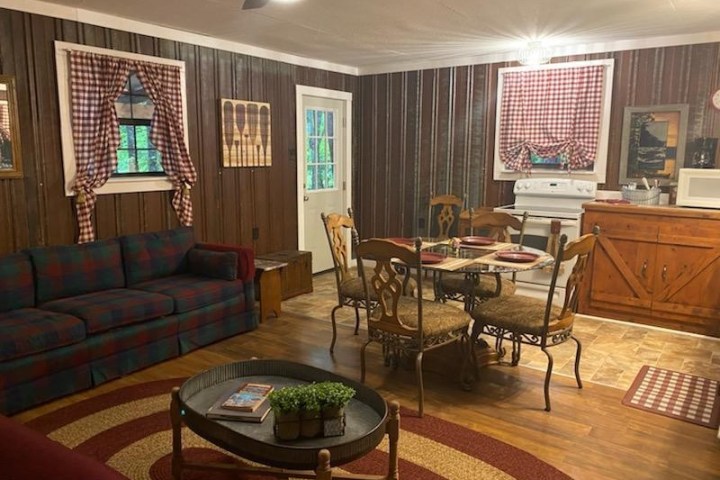 a living room filled with furniture and a large window