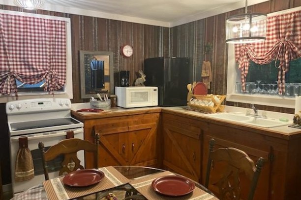 a kitchen with a sink and a window