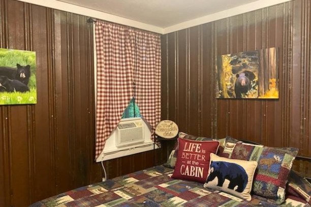 a living room filled with furniture and a large window