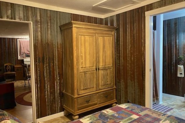 a bedroom with a wooden door