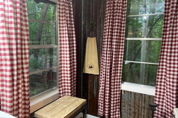 a shower curtain next to a window