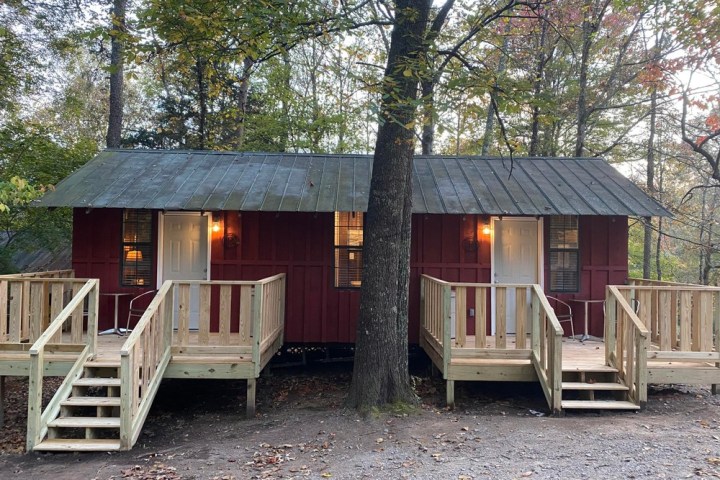 a wooden bench in front of a house