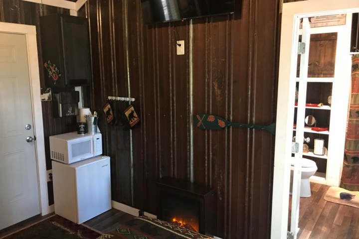 a kitchen with a sink and a mirror