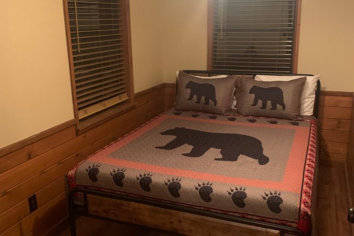 a bedroom with a bed in a room