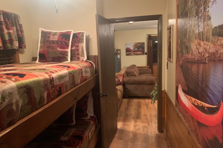 a bedroom with a bed in a room