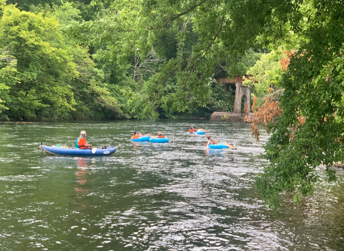 a group of people on a boat in the water